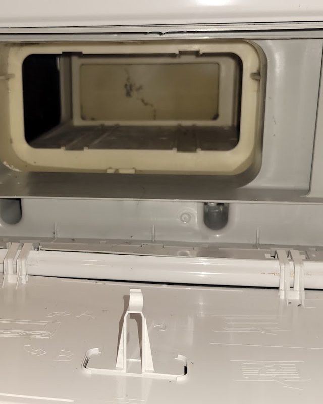 Dryer condenser compartment after: lint and debris fully removed