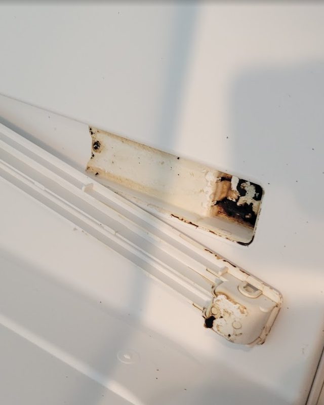 Fridge shelf rail before: dark grime and residue buildup